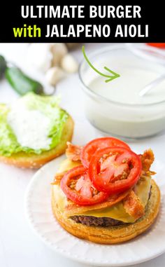 the ultimate burger with jalapeno aioli is ready to be eaten and served