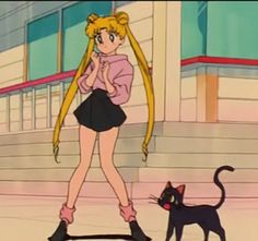 a girl with long blonde hair standing next to a black cat