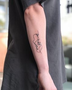 a person with a tattoo on their arm