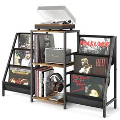 a record player stands next to a rack with records