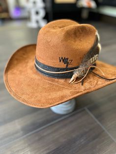 Custom 1 of 1 Warren Zeiders cowboy hat. With 717 album brand, initial branding.  Leather hat band, feathers size medium Men’s Cowboy Hats, Western Flat Bill Hat For Rodeo, Western Style Flat Bill Hat For Rodeo, Western Hat Bands For Country Events, Western Flat Bill Top Hat For Rodeo, Western Style Flat Bill Top Hat For Rodeo, Western Style Top Hat For Rodeo With Flat Bill, Custom Brown Hat Bands For Ranch, Custom Brown Felt Hat For Ranch