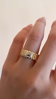 Cigar band engagement rings are the best way to make a modern statement with your forever piece. Its thicker gold band adds masculine tones, while the "Champagne" Diamond turns up the femininity. 

Cigar engagement ring, engagement ring, thick engagement ring, chunky engagement ring, thick gold jewelry, chunky gold jewelry, gold jewelry, gold, Diamond ring, Champagne Diamond, Art Deco jewelry Solitaire Diamond Ring With Wide Band For Promise, Yellow Gold Solitaire Jewelry With Wide Band, Diamond Solitaire Ring With Wide Band, Vvs Clarity Diamond Promise Ring With Thick Band, Emerald Ring With Vvs Clarity And Round Band, Fine Jewelry 14k Gold Baguette Cut Signet Ring, 14k Gold Baguette Cut Signet Ring, Timeless Thick Band Diamond Promise Ring, Anniversary Ring With Vs Clarity And Thick Band