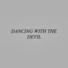 the words dancing with the devil written in black on a gray background, against a white backdrop