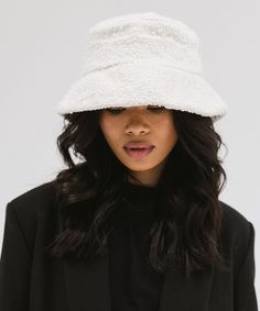 Our bouclé bucket hat is characterized by its signature texture, silky satin liner, + adjustable inner band. The Sundance includes piping along each seam. A structured additional inner layer allows you to wear your brim turned up or down with confidence. White Reversible Short Brim Hat, White Short Brim Reversible Hat, White Reversible Short Brim Bucket Hat, White Reversible Bucket Hat With Short Brim, White Reversible Bucket Hat With Curved Brim, White Reversible Wide Brim Bucket Hat, White Reversible Brimmed Bucket Hat, Style Bucket Hat, Halo Style