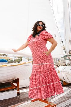 Introducing the Liberty Dress - where classic charm meets playful prints! Crafted from a delightful red & white gingham print cotton blend, this dress is a patriotic statement with a hint of retro romance. The sweetheart neckline adds a touch of sweetness, perfectly complemented by the playful puff sleeves. And let's not overlook the charming maxi-length skirt adorned with buttons, adding a dash of whimsy to your Fourth of July festivities. Available in sizes 00-34W!! summer dress, summer Retro Square Neck Midi Dress For Summer, Retro Square Neck Midi Summer Dress, Fitted Cotton Midi Dress For Picnic, Fitted Gingham Midi Dress With Square Neck, Gingham Dress With Short Sleeves For Garden Party, Retro Square Neck Dress For Picnic, Summer Picnic Dress With Sweetheart Neckline, Square Neck Cotton Midi Dress For Picnic, Cotton Midi Dress With Square Neck For Picnics