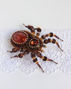 "Spider brooch it is embroidered brooch by bead and gimp. This woodlander jewelry is best Halloween gift. Spider jewelry has a has a size approximately 3.2*2.7 inches (8*7 cm). Beaded spider brooch, designer's jewelry inspired by Nature - insect brooch Spider with imitation of amber, Czech crystal beads. It will perfectly complement your unique jewelry collection or will be a wonderful gift as a Halloween brooch. Looks very elegant! A Spider jewelry brooch is carefully bead embroidered on leathe Handmade Brooches For Halloween Gift, Halloween Brooch, Spider Brooch, Insect Brooch, Spider Jewelry, Beaded Spiders, Embroidered Brooch, Jewelry Brooch, Bead Embroidery Jewelry