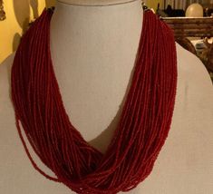 This is a Museum Quality Naga Necklace. It has 77 strands of finely strung red glass beads, plus the back has multi colored glass beads...the clasp is horn buttons and loop for closure. This beautiful necklace was made by the Konyak Naga Tribe. I am not an expert on the Konyak Naga Tribes People, I just know where it originated when I purchased it back in there 90's. It measures 23 inches long. It is a Master Piece of Bead Work. Artisan Red Faceted Beads, Multi-strand Red Coral Beaded Necklaces With Polished Beads, Artisan Multi-strand Red Beads, Konyak Naga, Naga Tribe, Norfolk Va, Master Piece, Beautiful Necklace, Necklace Vintage