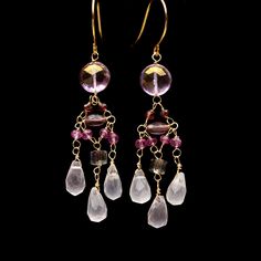 Colorful pink long dangling chandelier earrings made with multiple pink, purple, and reddish-toned gemstones including mystic topaz, garnet, rose quartz, amethyst, crystal, and mystic sapphire. The earrings are wired using nickel-free gold-toned wire and nickel-free French ear wire. The super light-weight design is comfortable to wear and makes a big statement.  I also make this design in Rainbow and Purple. Listings here: https://www.etsy.com/listing/1439337040/rainbow-gemstone-dangling-chandel Wedding Dangle Chandelier Earrings With Gemstone Accents, Wedding Chandelier Earrings With Gemstone Accents, Fine Jewelry Gemstone Chandelier Dangle Earrings, Amethyst Drop Earrings With Dangling Beads, Dangling Chandelier, Free In French, Rainbow Gemstones, Mystic Topaz, Pink Gemstones