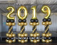 balloons and staffs are arranged in the shape of numbers for a new year celebration