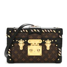 This is an authentic LOUIS VUITTON Monogram Studded Petite Malle in Black. This stylish trunk bagis crafted of Louis Vuitton monogram on toile canvas and calfskin leather. The bag features an optional leather cross-body shoulder, black leather trim at all corners, and studs at the joints with brass buckles and a brass press lock.  This opens to a beige leather interior with a small patch pocket. Black Louis Vuitton, Trunk Bag, Leather Cross, Brass Buckle, Leather Interior, Bag Straps, Leather Trim, Authentic Louis Vuitton, Handbag Accessories