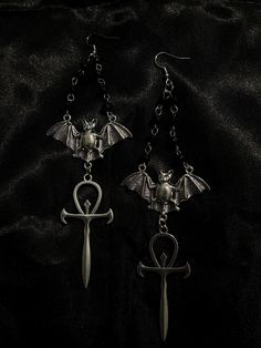 bat ankh cross rosary earrings || gothic jewellery || gothic || alternative || goth || vampire || witch || halloween jewellery || alt jewellery ♱ stainless steel hooks ♱ tibetan silver alloy pendants ♱ please keep this item away from water, oils & perfumes to preserve the quality ♱ £1.50 2nd class royal mail shipping on all orders to the uk, shipping available for eu ♱ if you experience any issues with your order, please do not hesitate to contact me, i'll always be happy to help. additionally any questions just ask :) vampiremoonjewellery Rosary Earrings, Halloween Jewellery, Cross Rosary, Vampire Witch, Goth Vampire, Ankh Cross, Gothic Jewellery, Earrings Gothic, Witch Halloween