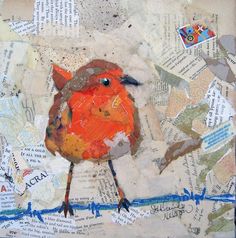 an orange bird sitting on top of a piece of paper covered in torn up papers