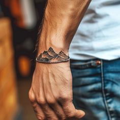 Artistic Wrist Tattoos For Men Tattoo Sketches Mens Clavicle Tattoo, Western Knife Tattoo, Men Tattoo For Kids, Breckenridge Tattoo, Men’s Nature Tattoo, Tree Sleeve Tattoo For Men, Men’s Small Tattoos Wrist, Small Arm Tattoos For Guys Forearm, Mountain Wrist Tattoo