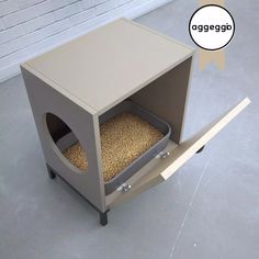 a dog house made out of cardboard with a cat in it's litter box