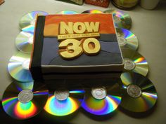 an image of various cd's and cds on the table with different colors in them