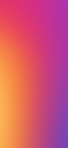 a blurry image of an orange and pink background