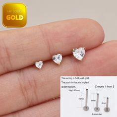 Metal: 14k solid gold, Available Gold color: Yellow gold  Guaranteed Authentic : 14k Solid Gold，Not Gold Plated or Gold Filled Stone:  CZ Thickness:0.82mm (20G) Stamp:14k ★Every ear is different, the length of backings that most suitable for your ear will depend on your ear thickness ★Titanium is a very safe metal, so we don't plate it, in order to avoid some people are allergic to the plating material. NOTE The item combined by 14k solid gold and implant grade titanium push in back,  Sold as single piece, packed in a beautiful Jewelry Box   SHIPPING ADDRESS All the orders will ship to the supplied address through your Etsy Order, Please leave your phone number,will give to carrier for safe deliver. We will not send and replacement parcels due to incomplete or inaccurate address.  PACKING 14k White Gold Piercings For Anniversary, Dainty Tarnish-resistant Cartilage Earrings For Anniversary, Dainty Single Earring For Valentine's Day, Gold Heart Jewelry With Internally Threaded Details, 14k Gold Tarnish-resistant Piercings As A Gift, Gold Sterling Silver Piercings As A Gift, Gold Internally Threaded Body Jewelry As Gift, Heart Charm Piercings As Gift, Silver Heart Piercings For Valentine's Day