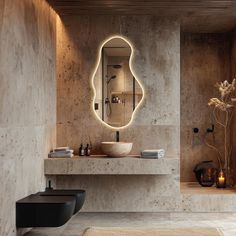 a bathroom with a sink, mirror and lights on the wall above it's counter