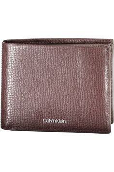 Discover sophistication with this Calvin Klein wallet, perfect for the modern man. With two spacious compartments and a dedicated coin purse, it keeps your essentials organized in style. Its RFID blocking technology ensures your card data remains secure, while the contrasting details add a touch of elegance. The embossed logo is a nod to the iconic Calvin Klein heritage, making it a timeless accessory. Material: 100% Leather Country of origin: CN Color: Brown Calvin Klein Wallet, Men Wallet, Rfid Blocking Wallet, Brown Leather Wallet, Timeless Accessories, Leather Wallet Mens, Classic Leather, Embossed Logo, Modern Man