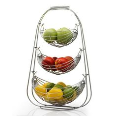 three metal baskets filled with fruit sitting on top of each other