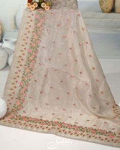 Embrace the ethereal charm of our Oatmeal-White floral embroidered organza saree, paired with an exquisitely crafted printed blouse. The sheer, airy fabric adorned with delicate floral embroidery captures a timeless elegance and modern sophistication. Perfect for any special occasion, this ensemble ensures you radiate grace and beauty. Step into a world of refined allure and leave a lasting impression. The blouse comes with an added allowance, and it can be altered to a standard size of 34"-42" Embroidered Organza, Whatsapp Message, Organza Saree, Photographic Lighting, Dress Clothes For Women, Printed Blouse, Floral Embroidery, Timeless Elegance, Favorite Outfit