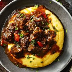 a plate filled with pole steak and grits