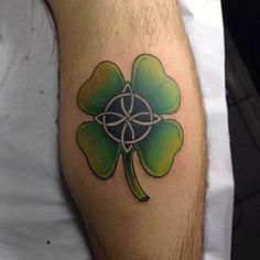 a man with a shamrock tattoo on his leg