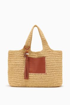 Our Kamari Tote is a refined, everyday bag made all the more elegant thanks to subtle detailing. Hand-woven from natural raffia, it has a roomy interior that’s unlined to maintain its drapey silhouette and has two top handles you can easily slip over your shoulder. A whipstitched-trimmed leather pocket on the outside secures smaller items, while the leather tassel with antique brass ring adds an elevated touch. Composition: 100% Polypropene Pair with the Menorca Maillot to complete the look. Elegant Tote Beach Bag With Braided Handles, Elegant Beach Bag With Braided Handles, Elegant Woven Leather Tote Beach Bag, Elegant Woven Leather Beach Bag For Travel, Elegant Natural Beach Bag With Braided Handles, Elegant Natural Hobo Bag With Woven Leather, Elegant Crochet Bag With Intrecciato Weave In Natural Color, Elegant Woven Leather Crochet Bag For Shopping, Rectangular Natural Hobo Bag With Intrecciato Weave