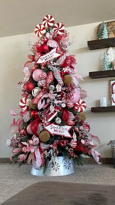 a christmas tree decorated with candy canes and ornaments