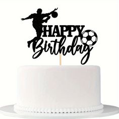 a birthday cake topper that says happy birthday with a silhouette of a man kicking a soccer ball