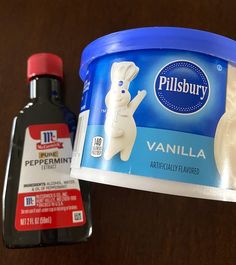 an ice cream container next to a bottle of pillsbury peppermint toothpaste