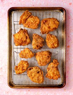 some fried food is on a metal rack