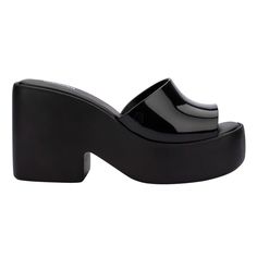 Embrace the revival of femininity in the fashion world with the Melissa Posh – the platform mule that's an essential addition to your collection! Inspired by the 90s and 2000s, it exudes a timeless nostalgic vibe. Despite the medium-height, robust heel, the shoe remains surprisingly lightweight, thanks to its advanced EVA technology. The single wide strap gives the style a minimalistic but mighty feel that will be sure to make your wardrobe even more extraordinary! 100% EVA  Despite the medium-height, robust heel, the shoe remains surprisingly lightweight, thanks to its advanced EVA technology. The single wide strap gives the style a minimalistic but mighty feel that will be sure to make your wardrobe even more extraordinary!  Wipe Clean Shoes 2000s, Y2k Shoes Clogs & Mules, Melissa Platform Sandals, Black Chunky Platform Slip-on Mules, Black Chunky Platform Slip-on Loafers, A2k Melissa, Black Clogs, Platform Mules, Clogs Style