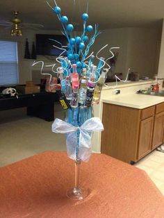 a vase filled with lots of different items on top of a table in a living room