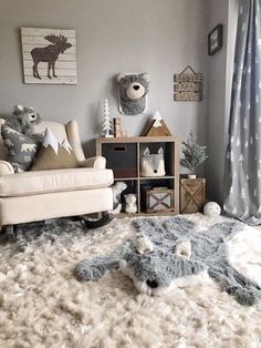 a teddy bear is laying on the floor next to a rocking chair and bookshelf