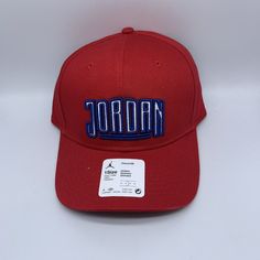 Air Jordan Script Jumpman Hat Snapback Cap Red Adjustable Snapback Hat With Curved Brim, Red Adjustable Visor Hat, Red Adjustable Hat With Embroidered Logo, Red Visor Hat For Streetwear, Red Adjustable Dad Hat For Streetwear, Adjustable Red Dad Hat For Streetwear, Red Trucker Hat With Curved Brim For Sports Events, Red Adjustable Sporty Trucker Hat, Red Snapback Baseball Cap For Baseball Season