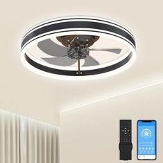 a ceiling fan and remote control in a room