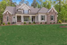 a large house with lots of windows in the front yard