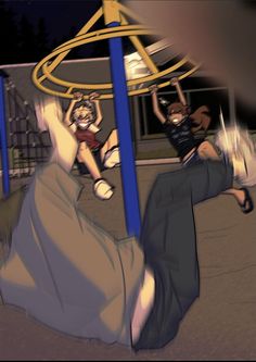 two children playing on a merry go round at night