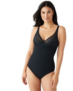 This shaper is the perfect addition to your wardrobe! It helps create a smooth silhouette while giving you an extra inch of lift. With adjustable straps and a cotton gusset, you'll get a comfortable fit that won't show through your clothes. Get ready for a flawless look with this amazing all-in-one shaper! Wacoal Elevated Allure Wire Free Shaping Body Briefer | Black | Intimates | Materials & Care Instructions: ['55% Nylon, 45% Elastane', 'Hand wash', 'Imported'] Black Intimates, Hipster Skirt, Body Shapewear, Convertible Bra, Body Shaper, Body Shapers, Sleek Look, Swim Dress, Black Bodysuit