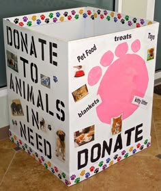 a cardboard box that has animals on it and the words donation to animals in need