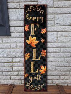 a sign that says happy fall y'all on it with leaves and acorns