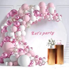 a party scene with balloons and confetti on the wall in pink, white and gold colors