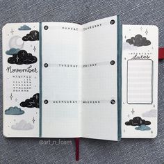 an open planner book with clouds and stars on it