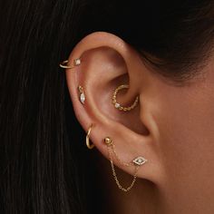 a close up of a person with ear piercings on their left and right sides