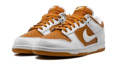 The Nike Dunk Low CO. JP "Reverse Curry" is an original colorway of the classic basketball sneaker from Nike’s former “Concept Japan” collection of the late-1990s and early-to-mid 2000s.  Debuted in 1999, the “Reverse Curry” was reissued in 2024 for the first time in celebration of the theme’s 25th anniversary.  The modern version features a Dark Curry leather base and white leather overlays and Swoosh branding.  Classic “Nike” branding on the heel is embroidered in a Dark Curry hue.  Additional Nike Retro Custom Sneakers With Branded Insole, Nike Retro Custom Sneakers, Nike Retro Low-top Custom Sneakers, Retro Nike Custom Low-top Sneakers, Vintage Low-top Basketball Shoes With Boost Midsole, Vintage Basketball Shoes With Rubber Sole For Streetwear, Retro Basketball Shoes With Gum Sole And Round Toe, Retro Basketball Shoes With Gum Sole, Vintage Low-top Basketball Shoes With Gum Sole