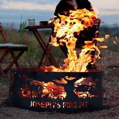 a man sitting in front of a fire pit