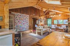 a living room filled with furniture and a fire place