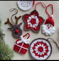 crocheted ornaments are arranged on a table