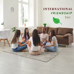 four women sitting on the floor in front of a couch and logo for international friends day